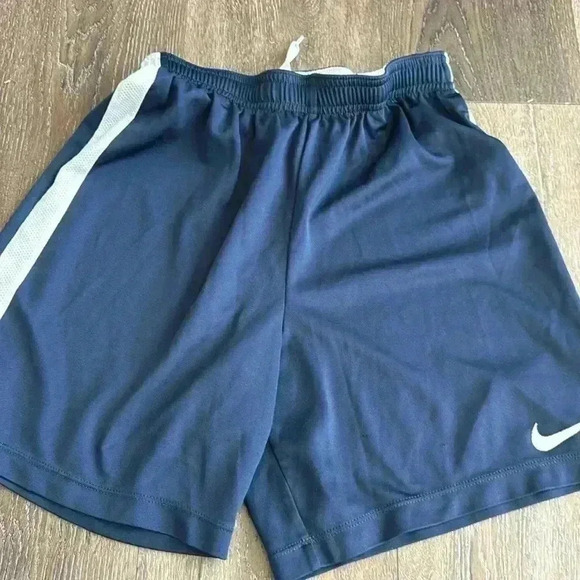Nike shorts.  Boys size large. Listing is for both pairs.  Both are navy blue. - Picture 4 of 7